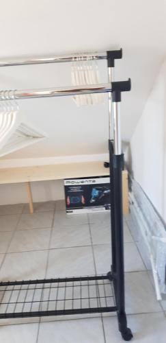 a bunk bed with a metal rail next to a table at Zusy in Orebić