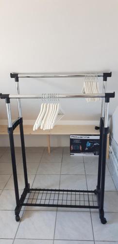 a rack filled with white utensils on a shelf at Zusy in Orebić