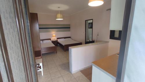 Postel nebo postele na pokoji v ubytování Trantas Rooms
