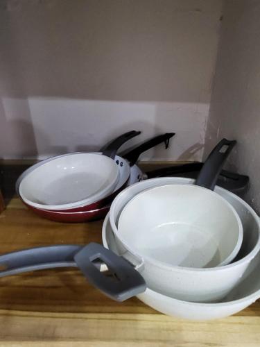 two white bowls are sitting on a table at Villa Milagro in Parrita