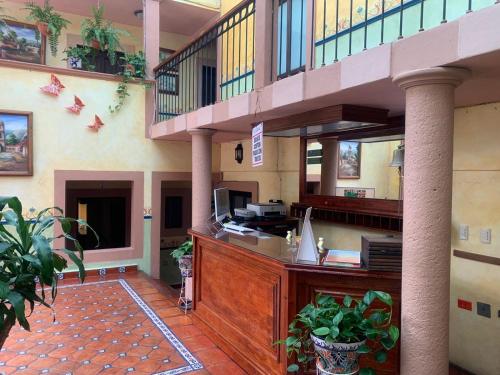a lobby with a reception desk in a building at Hotel Quinta Bella in Tula de Allende