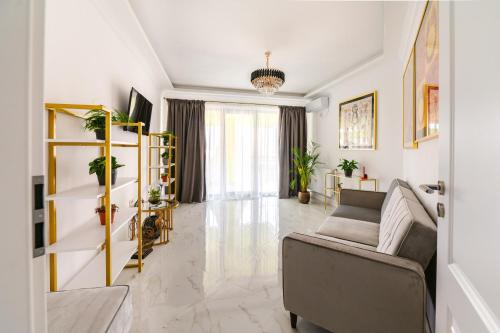 a living room with a couch and a table at Zig-Zag 17 apartment in Constanţa
