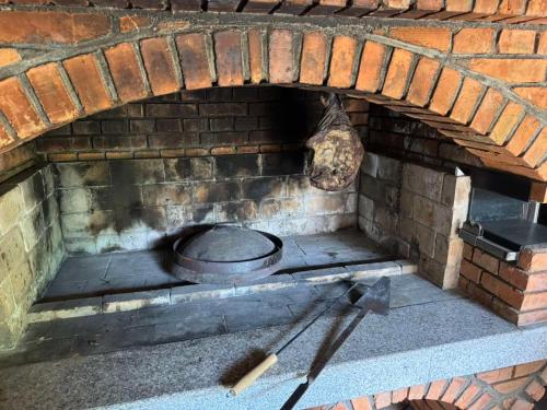 a brick oven with a pot on top of it at Villa Lavanda in Banja Luka