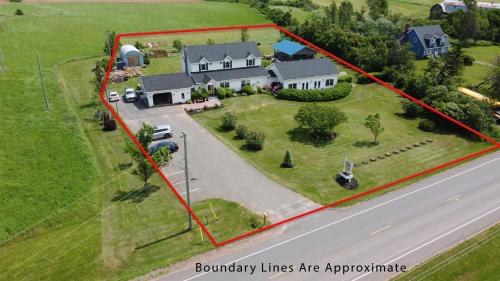 an aerial view of a house with a yard at Graham Inn in New Glasgow