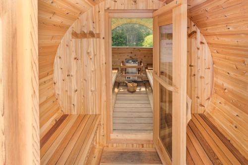 an inside view of a wooden sauna with wooden walls at Graham Inn in New Glasgow