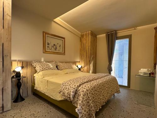 a bedroom with a bed and a window at Trabocco in Campagna in Lanciano