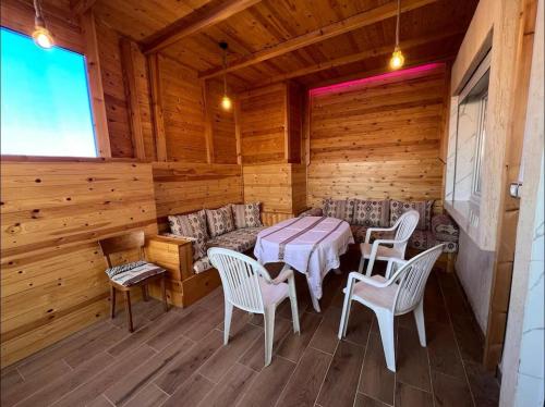a dining room with a table and chairs in a cabin at Luxurious apartment close to all amenities in Agadir