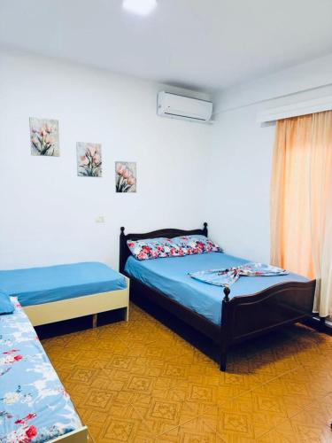 Llit o llits en una habitació de Vila Brahimasi