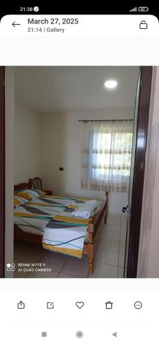 Ένα ή περισσότερα κρεβάτια σε δωμάτιο στο A & H Apartments Velipoje