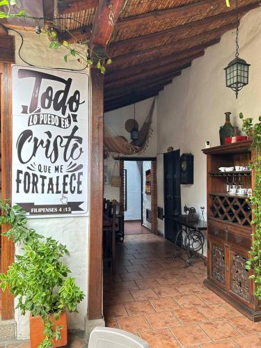 a store with a sign on the side of a building at Giron Chill Out Hotel Boutique in Girón
