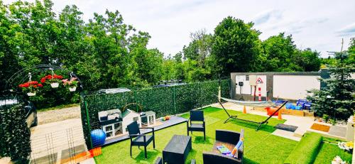 a backyard with a playground and a swing at AmurResidence 64 Sauna Parking Barbeque in Iaşi