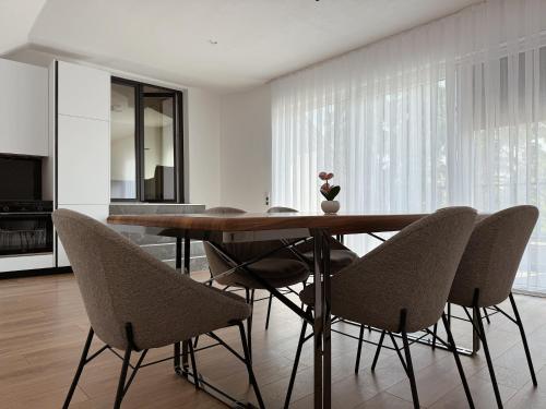 a dining room with a table and chairs at Peaceful Place Near Lake in Sankt Pölten