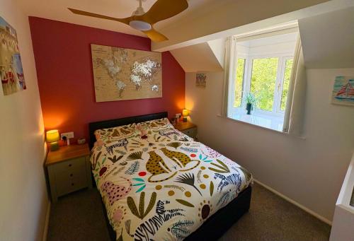 a bedroom with a bed and a window at Captain Cook Riverside Walk in Whitby