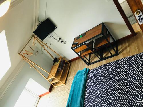 an overhead view of a room with a bed and a table at Pisgah Guesthouse Snowdonia in Blaenau-Ffestiniog