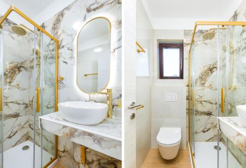 a bathroom with a sink and a shower at Wine house apartments & rooms Marčeta in Fažana