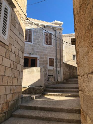 an alley with stairs leading to a building at Luca in Račišće