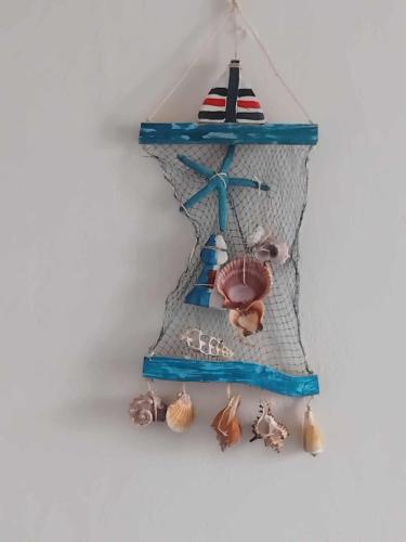 a toy boat with figurines on a shelf at stamatiou in Methana