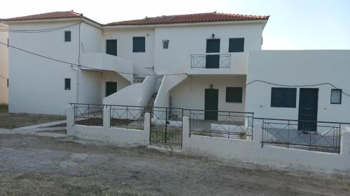 an external view of a white building at stamatiou in Methana