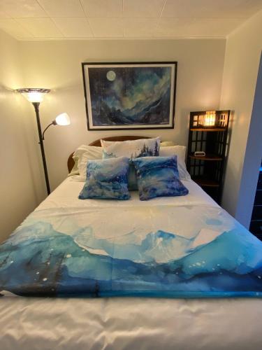 a bed with two pillows on top of it at Arctic Paradise B&B in Seward