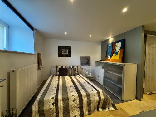 a bedroom with a large bed and a tv at Historic Town Luxe and Epic View in Clausen
