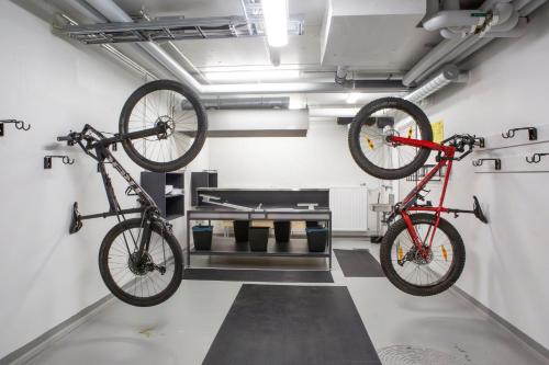 two bikes hanging from the ceiling in a garage at Ylläs Chalet 4 Ski-In, Incl 2 winter lift passes in Ylläsjärvi