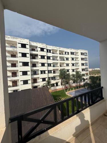 a balcony view of a large apartment building at apartment in complex city center in Oued Laou