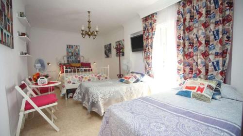 Postel nebo postele na pokoji v ubytování La Casa de La Abuela Rosy