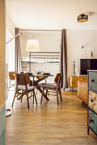 a dining room with a table and chairs at Alpenrausch 2 in Kiefersfelden