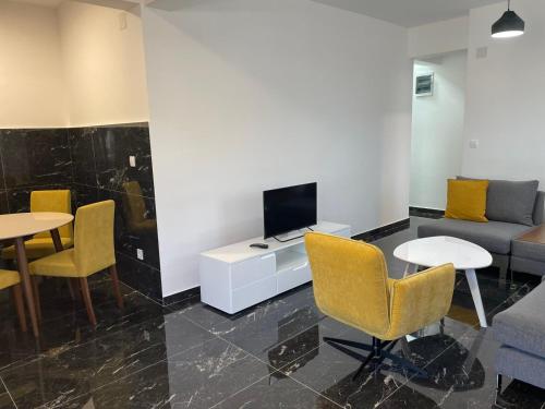 TV a/nebo společenská místnost v ubytování Greystone House Apartments