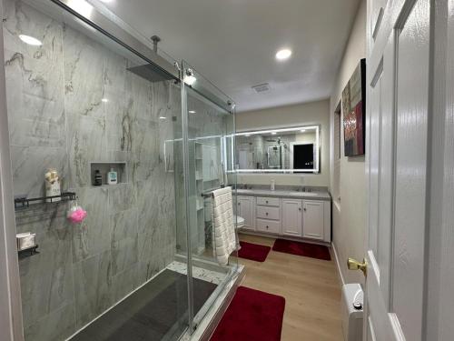 a bathroom with a shower and a glass shower stall at 5 Star Vacation Home in Ely Sleep 6 in Ely