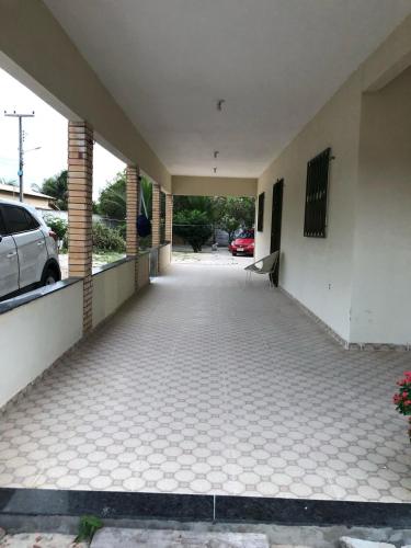 an empty hallway of a building with a parking lot at Refúgio do Mar in Beberibe
