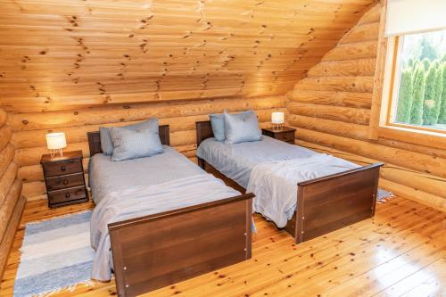 Postel nebo postele na pokoji v ubytování Saadumere puhkemaja