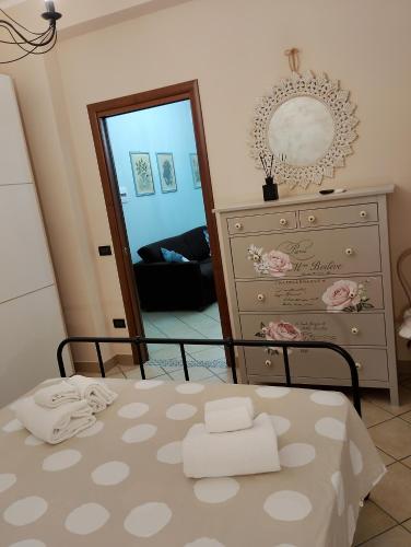 a bedroom with a dresser and a mirror at Mare Incanto in Gragnano