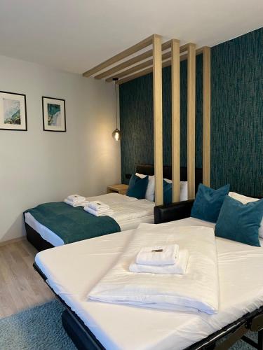 a hotel room with two beds in a room at Nekem Füred in Balatonfüred
