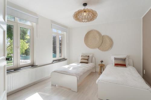 Postel nebo postele na pokoji v ubytování Vakantiewoning 't Hovenshuis