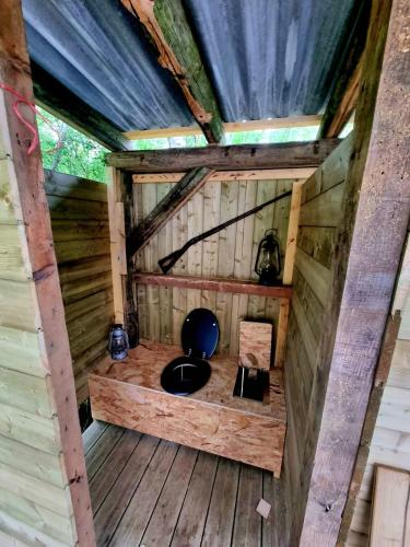 an inside view of a cabin with a toilet in it at Petit coin de Paradis in Saint-Michel-de-Lanès