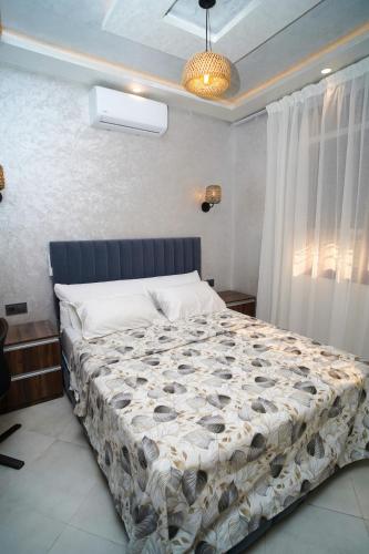 a bedroom with a large bed in a room at Luxury apartment in Tangier 3 in Tangier