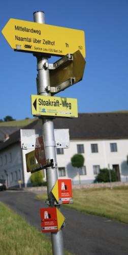 a pole with street signs on the side of a street at Wohnung im Herzen Mühlviertels in Bad Zell