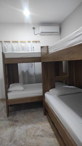 Postel nebo postele na pokoji v ubytování Casa Verano Lupita