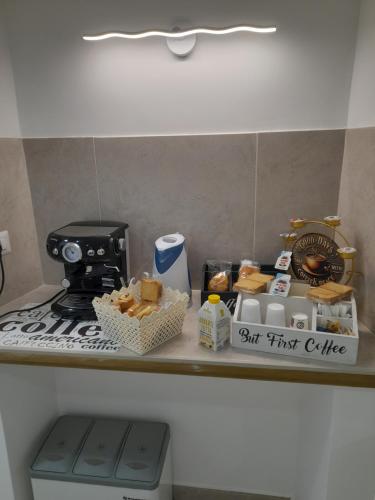 a kitchen counter with a stove and some food on it at Falanga Family Guests Accommodation in Civitavecchia
