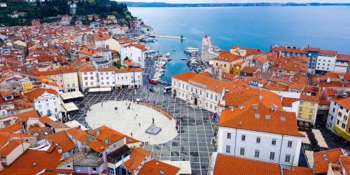 an aerial view of a city with orange roofs at Casa Istriana Center with free parking in Koper