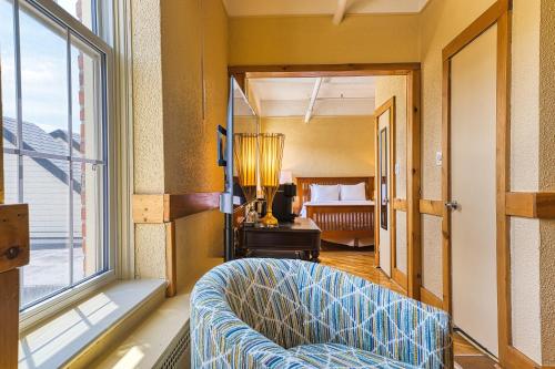 a living room with a couch and a window at The Stratford Hotel by Hoco Hotels Collection in Stratford