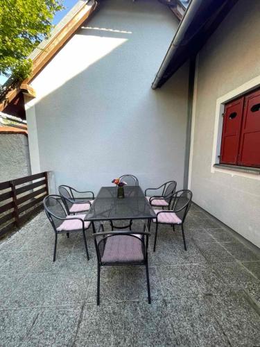 a table and chairs sitting on a patio at Terme Čatež apartma Maestro in Čatež ob Savi