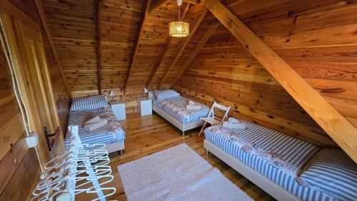 an overhead view of a room with two beds in a attic at Domek Wałowa 21 in Rewa
