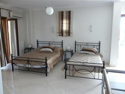 Ένα ή περισσότερα κρεβάτια σε δωμάτιο στο Artemis Luxury Apartaments Anaxos