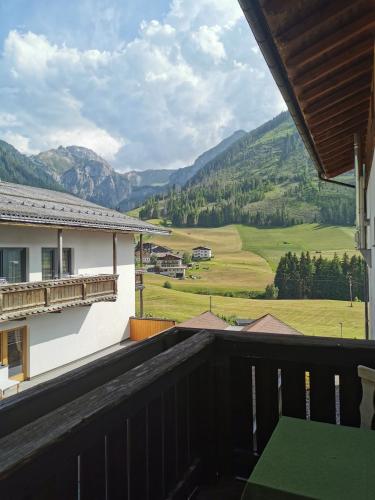 a balcony with a view of the mountains at Hotel Sonnblick in Kartitsch