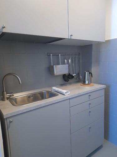 a kitchen with a sink and a counter top at Giada in Moneglia