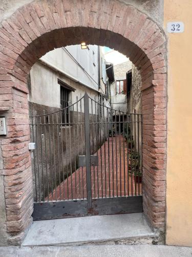 an entrance to a building with an iron gate at Grand Tour Suite Home in Spoleto