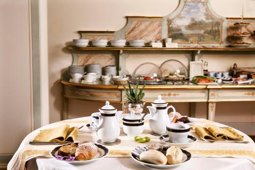 a table with plates of food on it in a kitchen at Villa Poggiano in Montepulciano