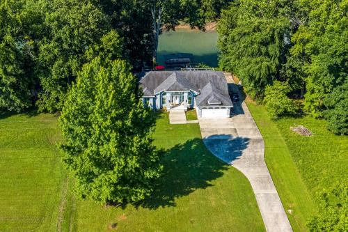 an overhead view of a house in the middle of a yard at Deck and Gas Grill Riverfront Home in Heber Springs in Heber Springs